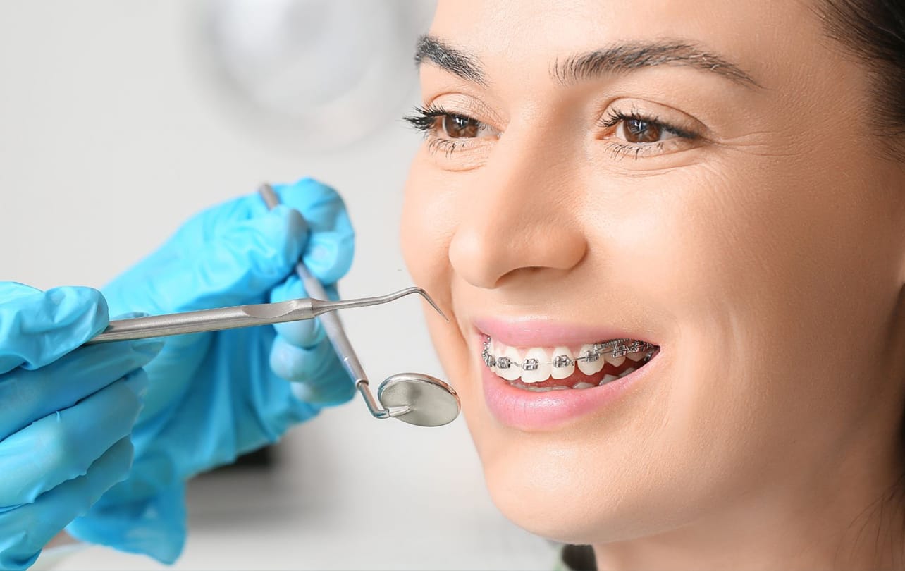 Orthodontic braces and clear aligner treatment for straight teeth